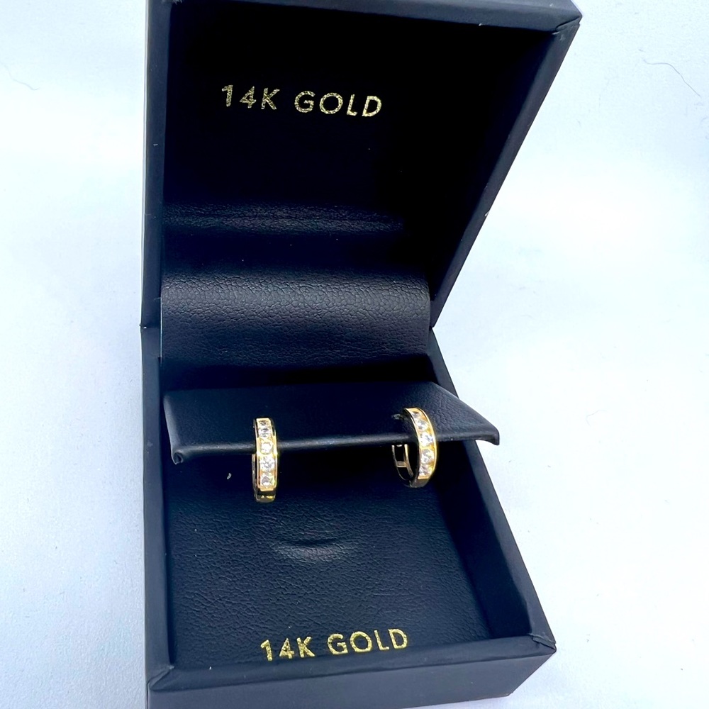 14 K gold small hoop diamond earrings. Brand new! Never worn.